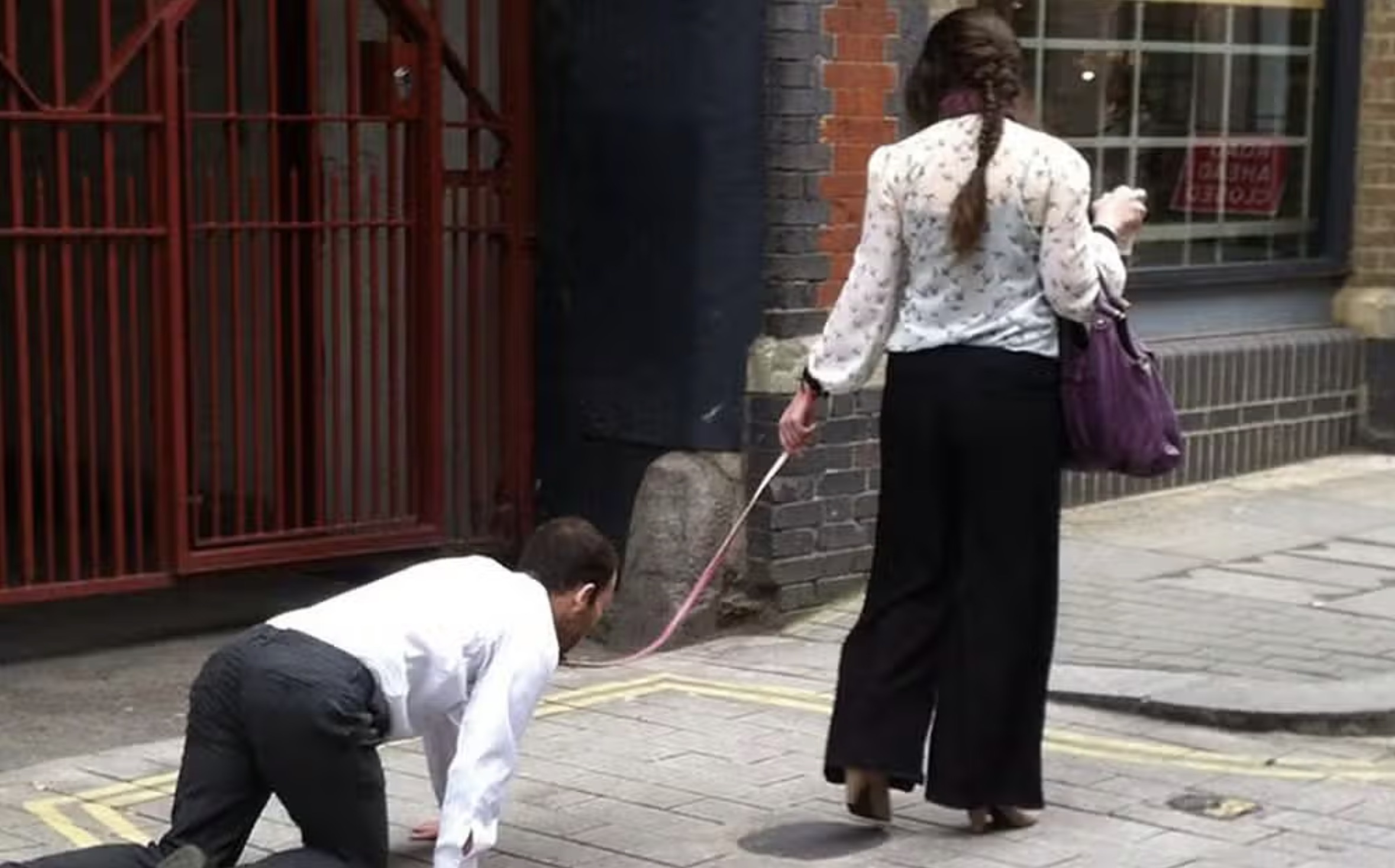 woman walking man on leash - Cloted Dasha